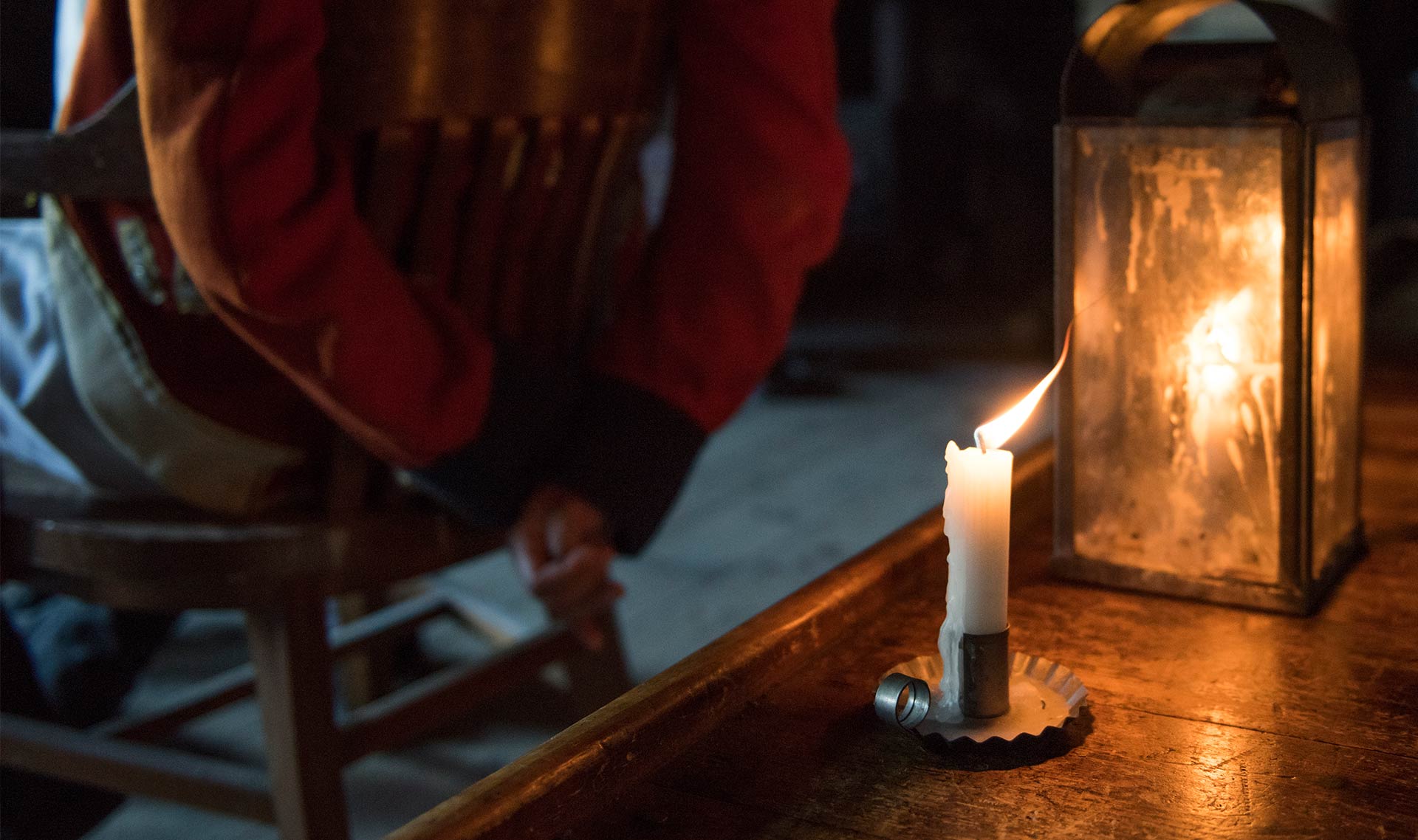 Candles lighting up in the dark