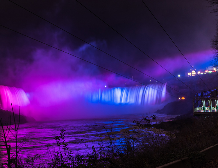 Illumination of purple and blue lights on Niagara Falls
